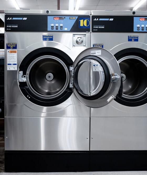 Self-service coin and card laundromat machines in Queens, NY